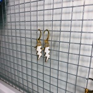 White lightning bolt earrings